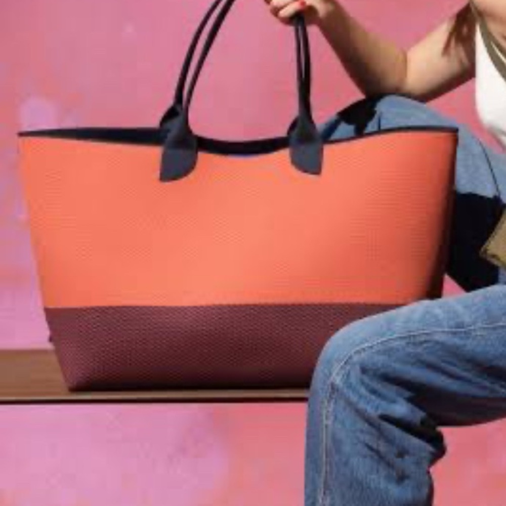 Rothy’s lightweight mega tote orange and Navy